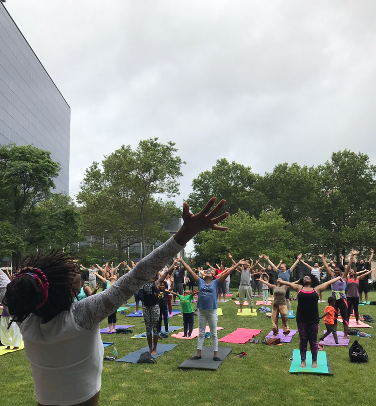 Yoga instructor with students in Newark