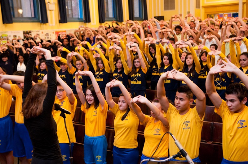 Students doing yoga in Newark school gymnasium