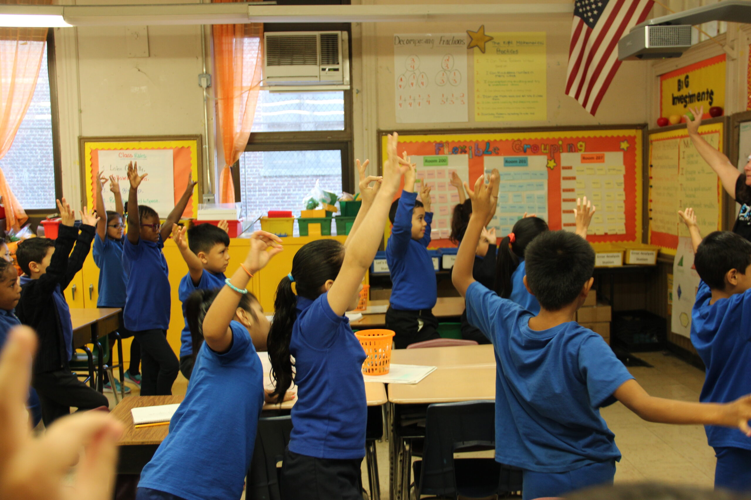 Large group of Newark students in yoga class